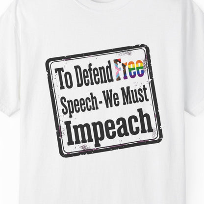 White short-sleeve crewneck t-shirt featuring a distressed black rectangular graphic with the text 'To Defend Free Speech - We Must Impeach' and the word 'Free' filled with a LGBTQ rainbow pattern.