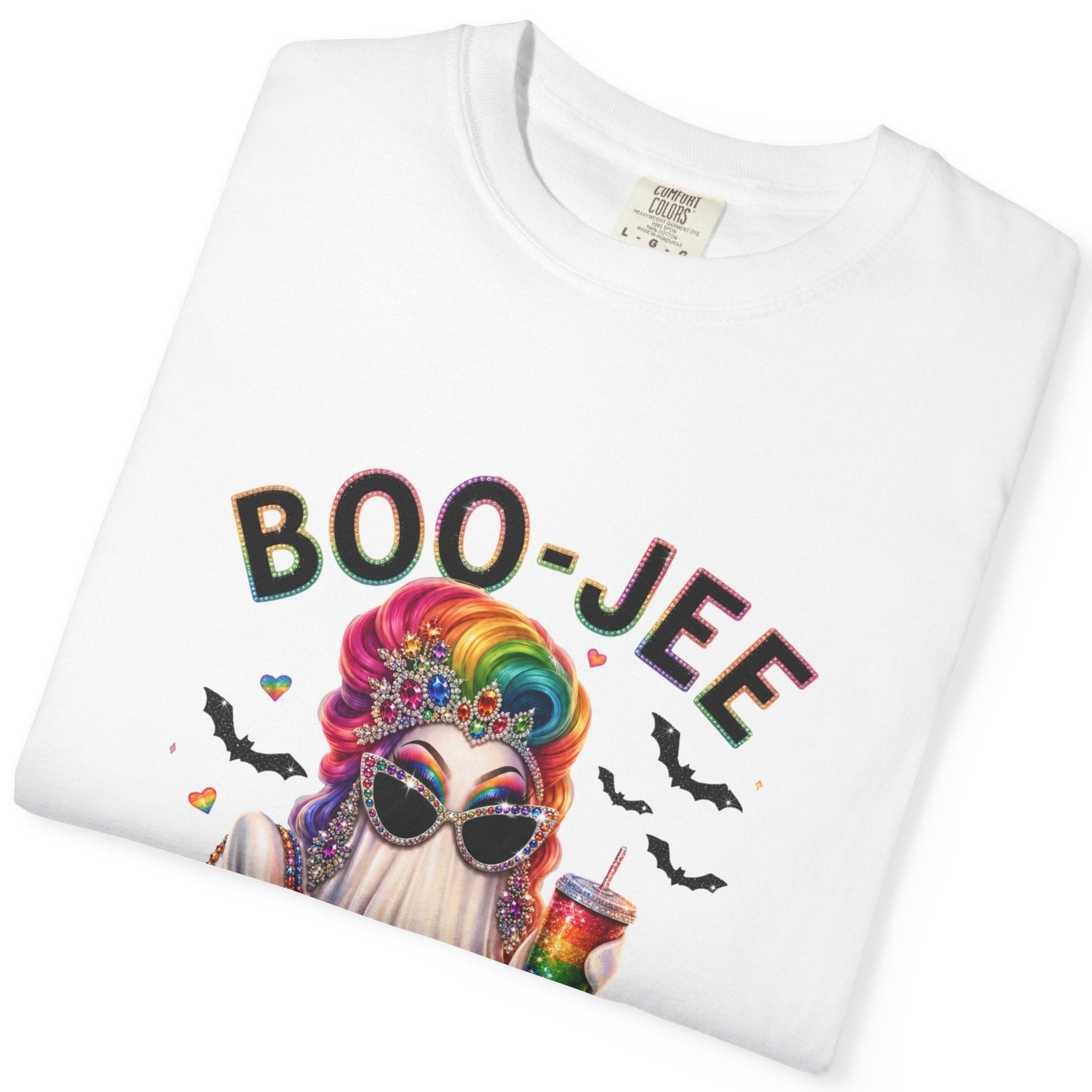 A folded white short-sleeve crewneck t-shirt featuring an LGBTQ rainbow graphic of a Drag Queen ghost in a holding a rainbow-striped bag, with the text 'BOO-JEE' above it, displayed on a solid white background.
