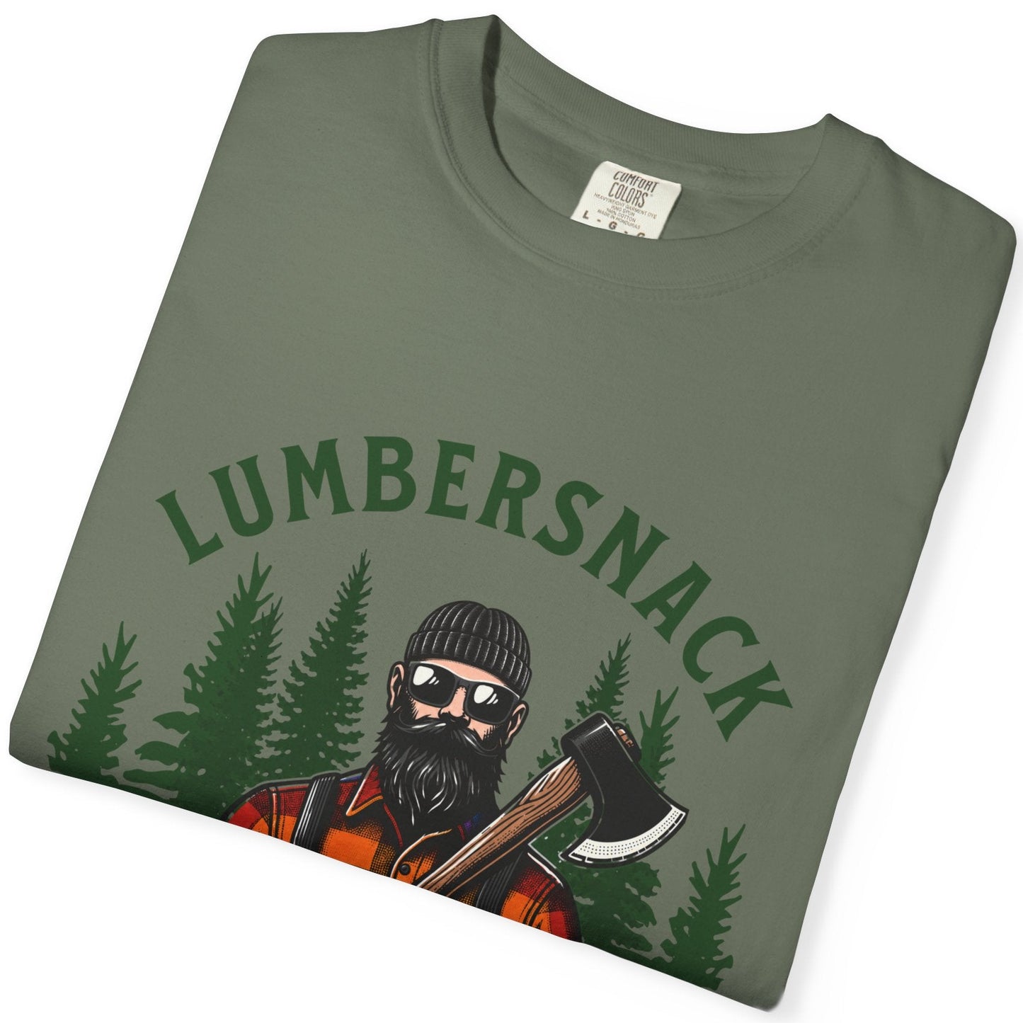 A folded olive green t-shirt with a graphic print of a lumberman holding an axe in front of pine trees, with the text 'LUMBERSNACK' arched above. The shirt is displayed on a clean white background.