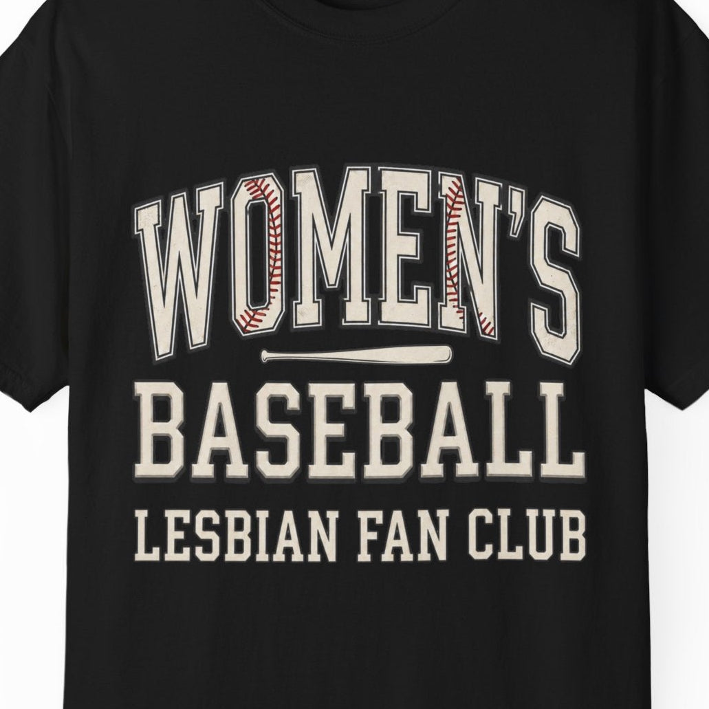 A black short-sleeve crewneck t-shirt with a distressed collegiate-style graphic reading 'WOMEN'S BASEBALL LESBIAN FAN CLUB' in cream and red, displayed on a clean white background.