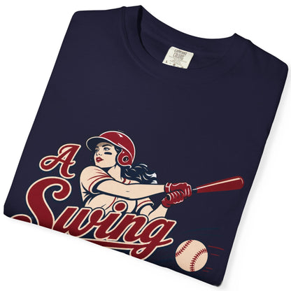 A folded black short-sleeve t-shirt with a vintage-style graphic of a pin-up girl baseball player, the text 'A Swing', and a baseball on the front, displayed on a clean white background.