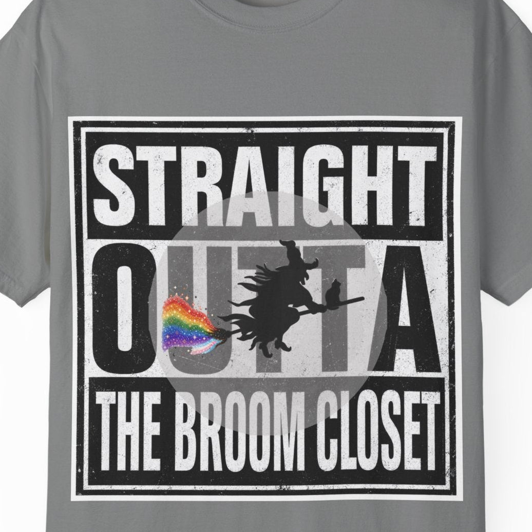 A gray short-sleeve crewneck t-shirt with a graphic on the front that reads 'STRAIGHT OUTTA THE BROOM CLOSET' in white text over a black background, featuring a silhouette of a witch and a small rainbow flag.