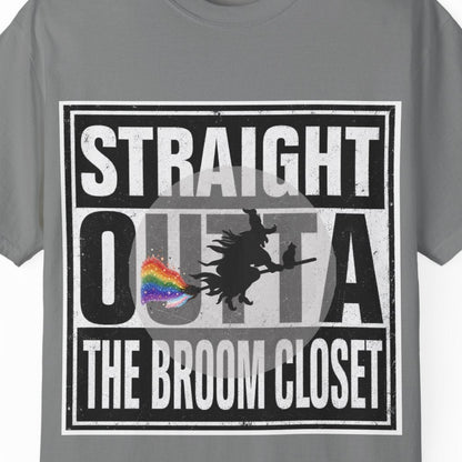 A gray short-sleeve crewneck t-shirt with a graphic on the front that reads 'STRAIGHT OUTTA THE BROOM CLOSET' in white text over a black background, featuring a silhouette of a witch and a small rainbow flag.