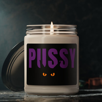 Lit Pussy Cat candle with dark background