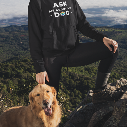 Mockup of person hiking with a dog wearing a black colored Gay Pride hoodie that says ASK ME ABOUT MY DOG with LGBTQ rainbow text| Pride t-shirt designed by Queer Energy 