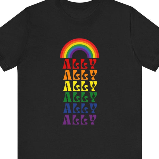 A LGBT Pride shirt that is black in color for a Gay Pride tee that says "Ally" with lgbtq rainbow colors| Pride t-shirt designed by Queer Energy 