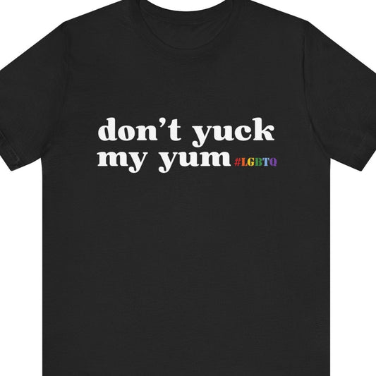 A black colored Gay Pride tee that says don't yuk my yum with LGBTQ in rainbow text| Pride t-shirt designed by Queer Energy 