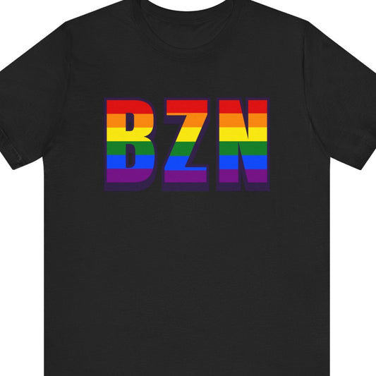 Black T-shirt that says BZN | Bozeman Yellowstone | Pride tee with the text in Pride rainbow colors
