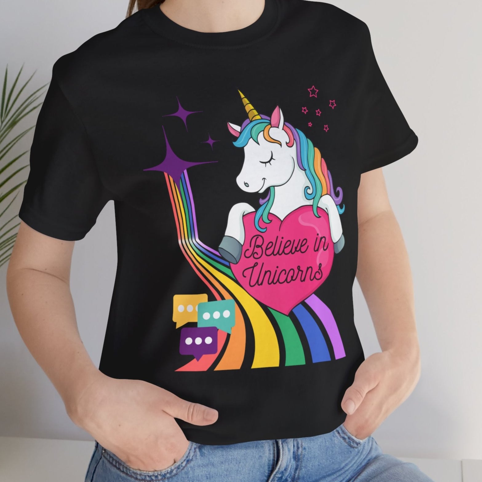 Gay pride t-shirt featuring Believe in Unicorns rainbow LGBTQ+ unicorn design – Designed by Queer Energy mockup of lesbian wearing black tee