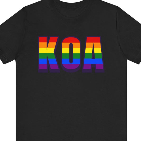 Black Pride T-shirt that says KOA | Kona International Airport | Queer Pride tee with the text in LGBTQ Pride rainbow colors