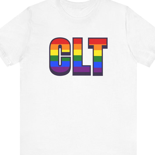 White T-shirt that says CLT | Charlotte/Douglas International Airport| Pride tee with the text in Pride rainbow colors