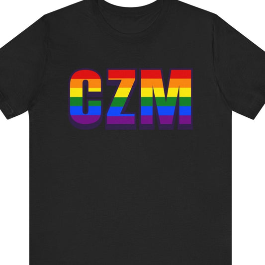 Black T-shirt that says CZM | Cozumel International Airport| Pride tee with the text in Pride rainbow colors