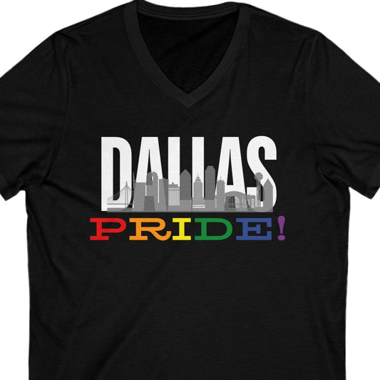 Black V-neck that says Dallas with the Dallas skyline overlayed with Pride in LGBTQ Pride colors