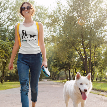 Lesbian wearing a racerback tank top that says "Dog Moms" while walking her dog