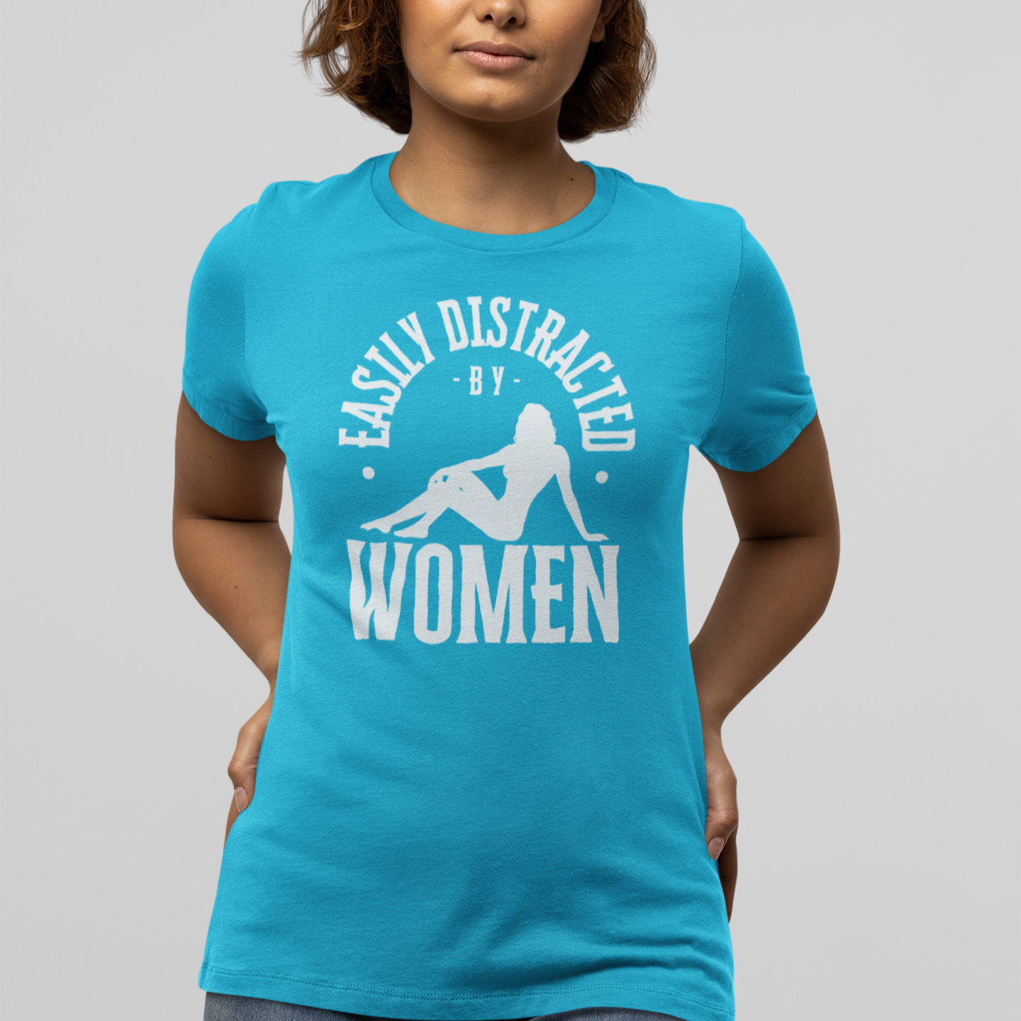 Mockup of a lesbian wearing a blue Gay pride t-shirt featuring EASILY DISTRACTED BY WOMEN funny lesbian LGBTQ+ design – Designed by Queer Energy