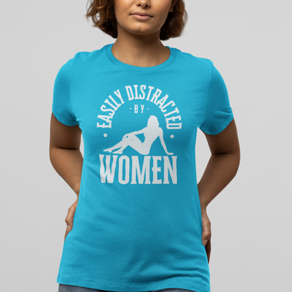 Mockup of a lesbian wearing a blue Gay pride t-shirt featuring EASILY DISTRACTED BY WOMEN funny lesbian LGBTQ+ design – Designed by Queer Energy