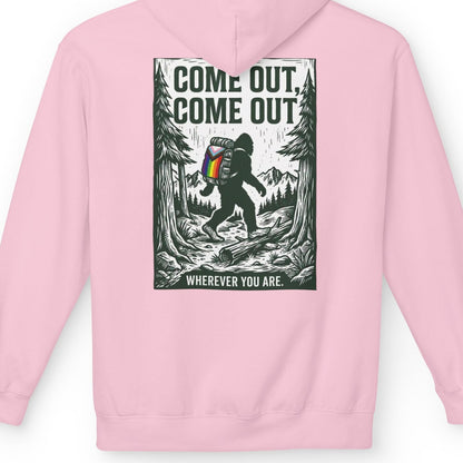 Gay pride pink hoodie featuring Come Out, Come Out, Wherever You Are - Bigfoot design with Progress Pride backpack on the back by Queer Energy