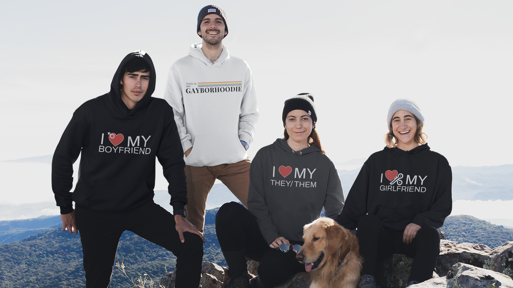 Group of queer people and a dog on a mountain with 'I ❤️ MY BOYFRIEND' text on clothing.