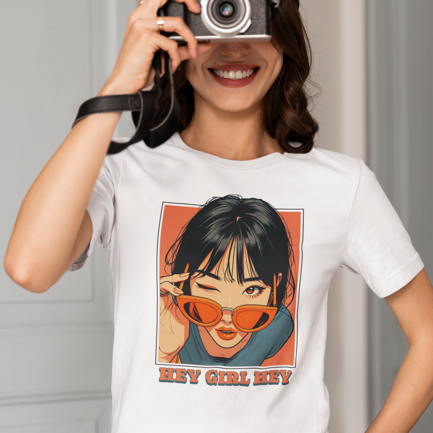 Lesbian wearing a white tee that says "HEY GIRL HEY"