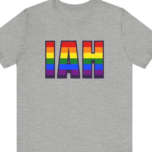 Gray T-shirt that says IIAH | George Bush Intercontinental Airport | Pride tee with the text in Pride rainbow colors