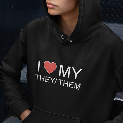 Nonbinary wearing a black hoodie with 'I ❤️ MY THEY/THEM' text.