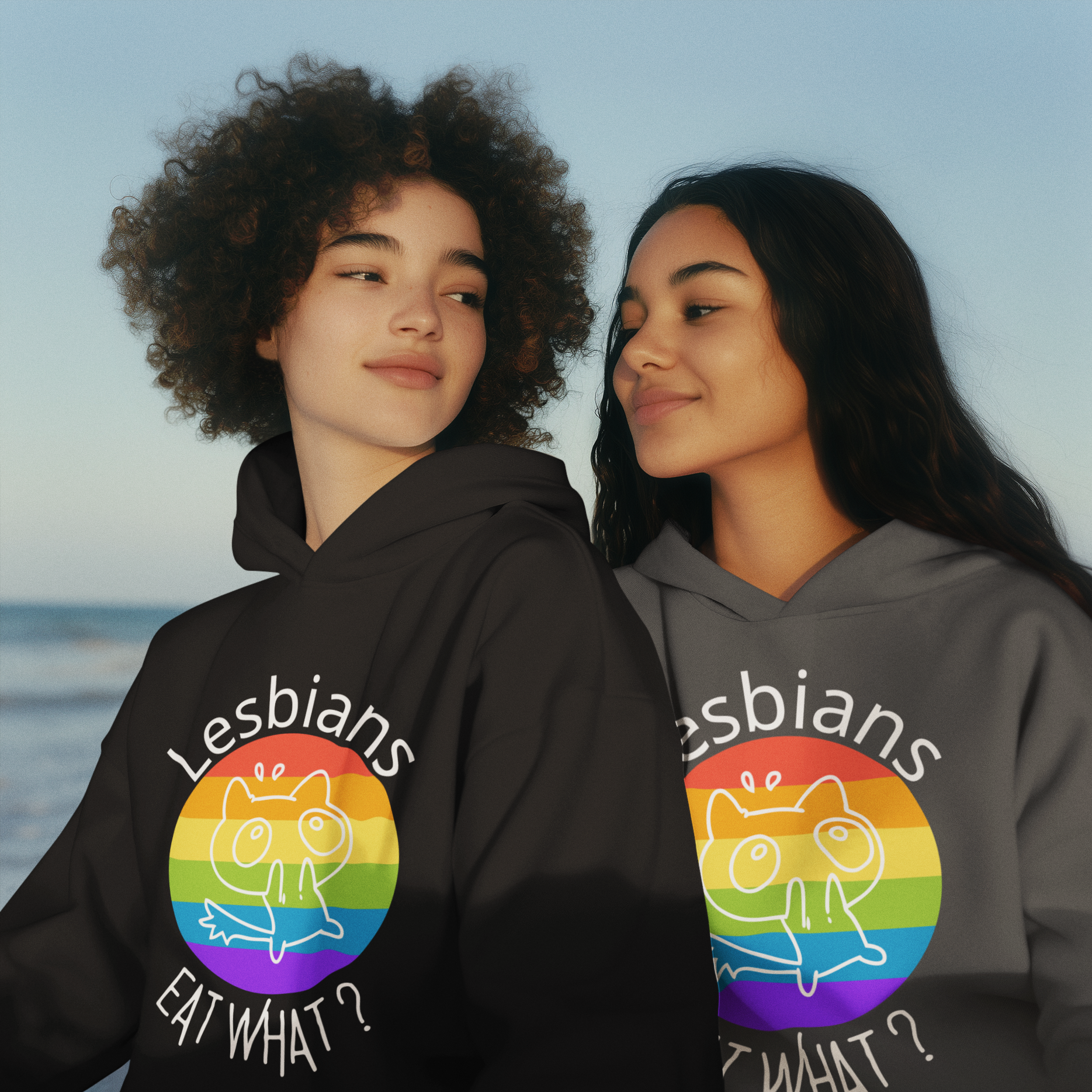 Lesbians_Eat_What_-_hoodie-mockup-of-a-smiling-ai-generated-women-couple-posing-in-a-beach-m53860 hoodies in black and gray