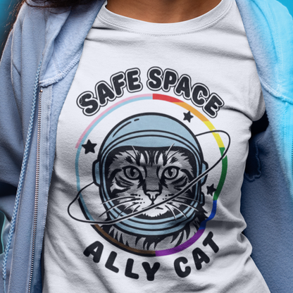 LGBTQ Ally wearing tee featuring a cat astronaut inside a rainbow ring with Safe Space Ally Cat design by Queer Energy.