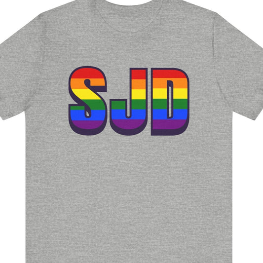 Gay pride t-shirt featuring SJD Los Cabos International Airport code in rainbow colors – Designed by Queer Energy in gray