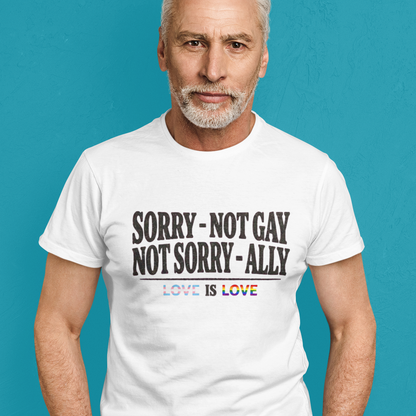 Straight man wearing a Gay pride tee featuring Sorry Not Gay Not Sorry Ally text with Love Is Love with progress flag accents by Queer Energy.