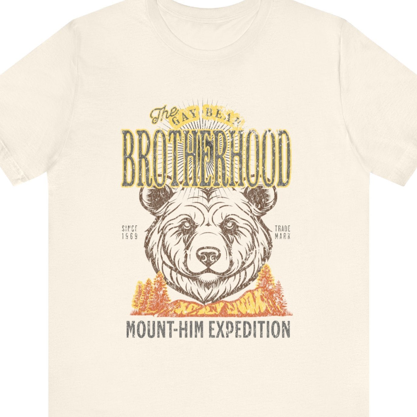 Beige t-shirt that says The Gay Bear Brotherhood Mount-him expedition