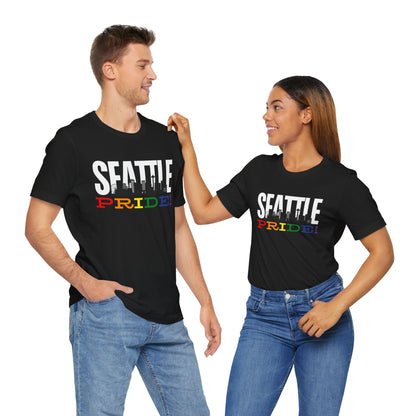 mockup of a gay man and a lesbian wearing Gay pride t-shirt with bold "SEATTLE PRIDE" text in rainbow colors – Designed by Queer Energy
