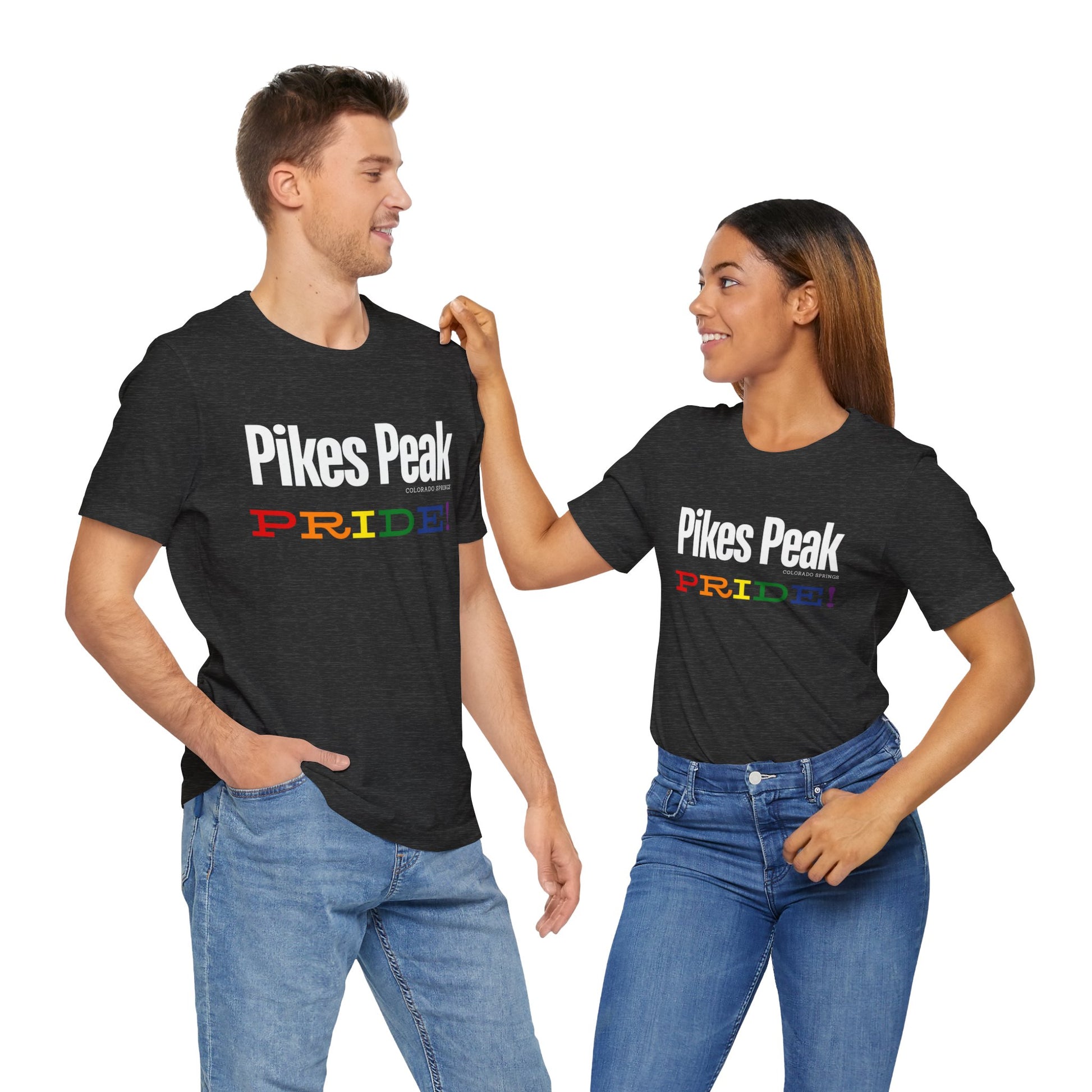 mockup of a gay man and a lesbian wearing black Gay pride t-shirts featuring the Colorado Springs skyline with rainbow accents – Designed by Queer Energy