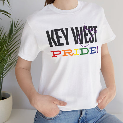 mockup of lesbian wearing white Gay pride t-shirt with bold "KEY WEST PRIDE" text in rainbow colors – Designed by Queer Energy